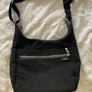 Black BAGGALLINI bag. Adjustable strap. Like new